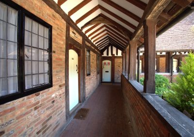 Balcony walkway with half-timbered roof