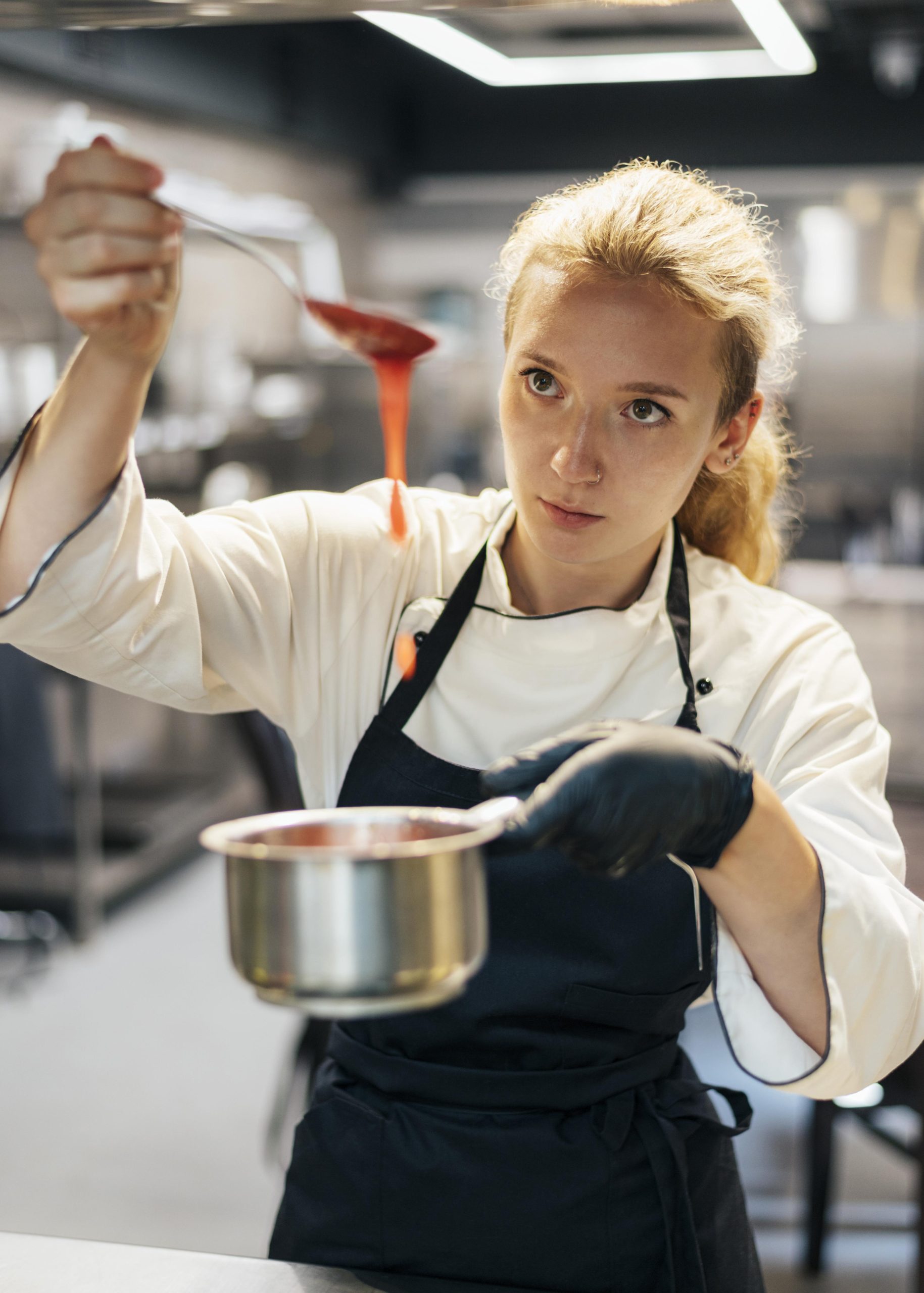 Female chef preparing a sauce Image 11228851 by Freepik