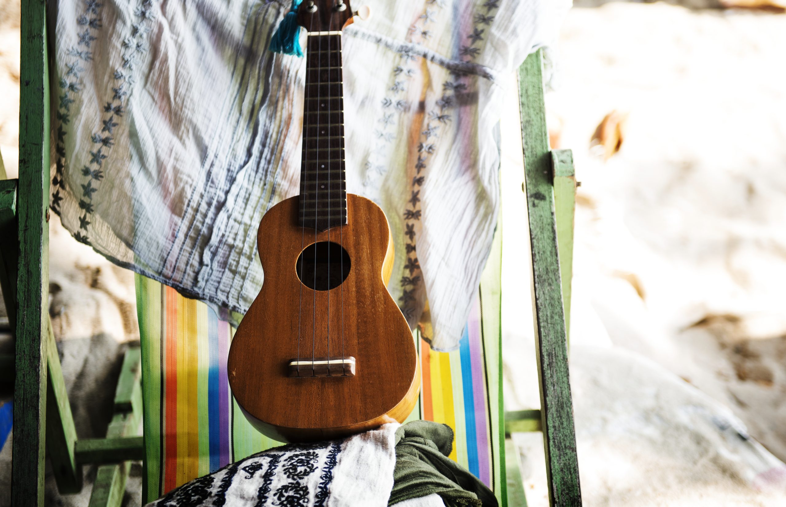 Ukelele and deck chair Image 2790750 by rawpixel.com on Freepik