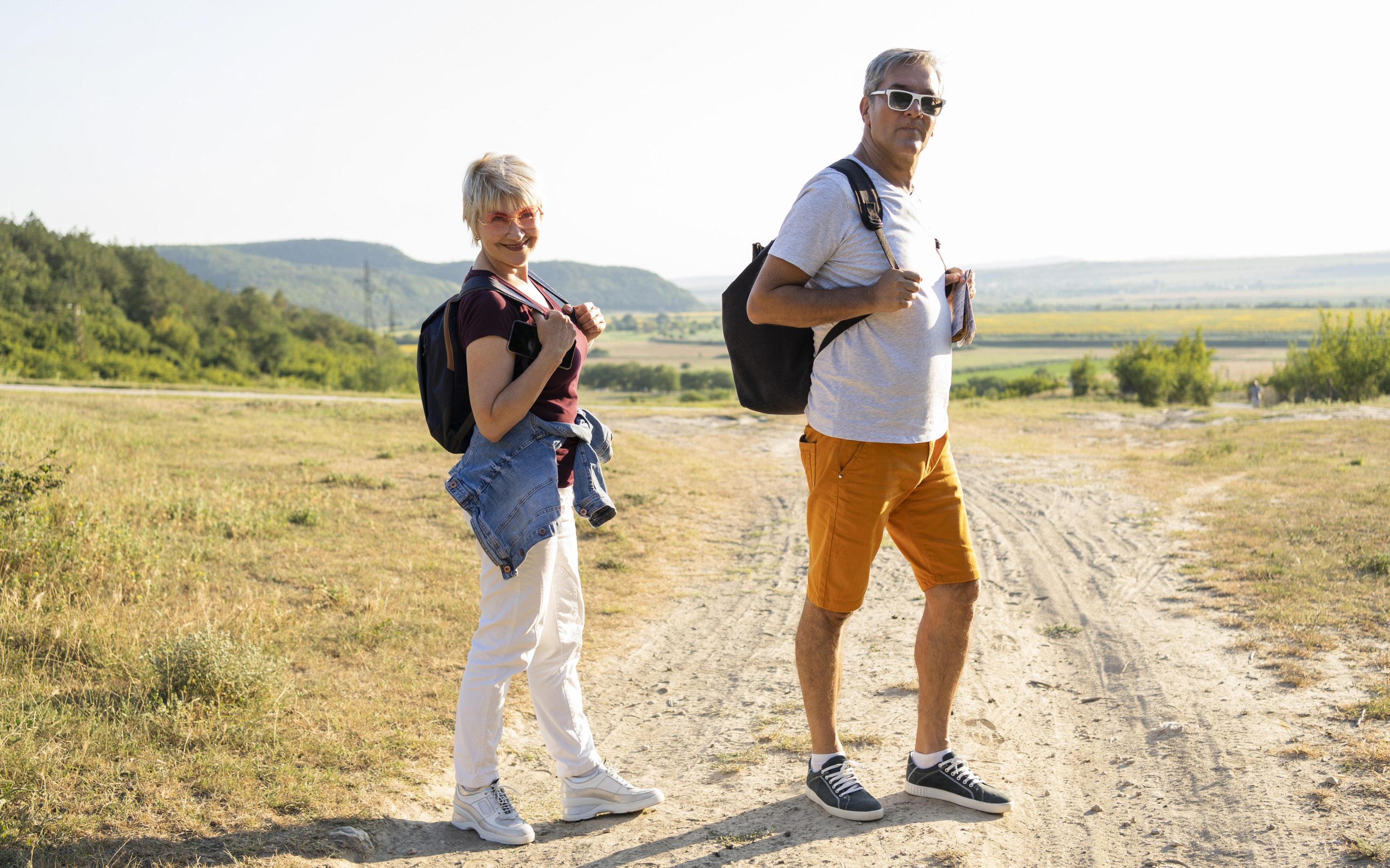 Full shot couple posing on a road from Magnific